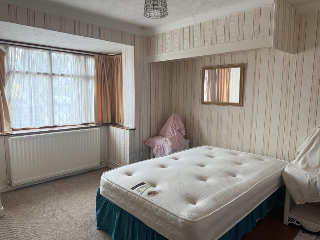 Lot: 109 - FOUR-BEDROOM DETACHED BUNGALOW FOR IMPROVEMENT ON 0.21 ACRES - Ground floor bedroom with wallpapered walls